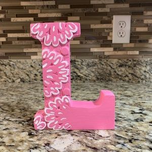 Wooden “L” decor piece.